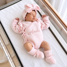 Load image into Gallery viewer, Baby wearing powder pink personalized romper, headband and knitted booties